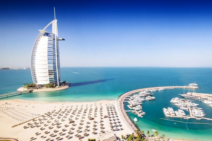 Experience the stunning blend of luxury and coastline in Dubai where iconic architecture meets pristine waters offering travelers a glimpse of modern marvels and coastal beauty.